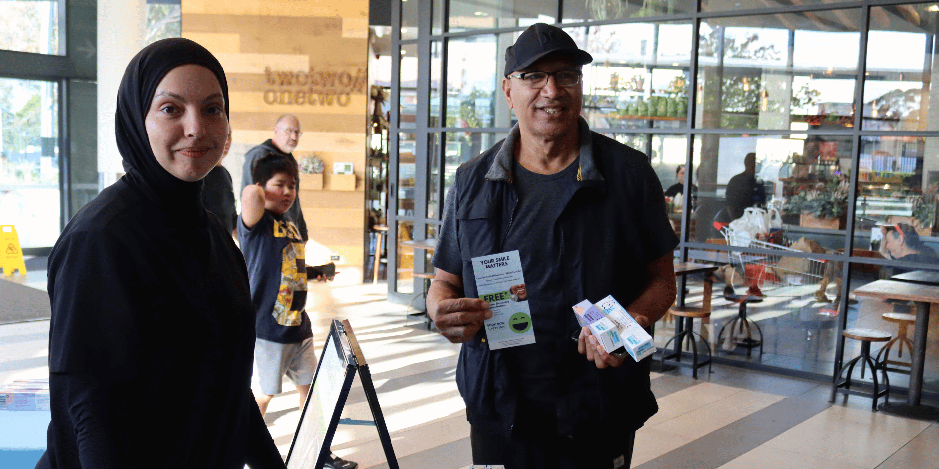 The Local Dentist Reveby team member distributing free Australian Dental Foundation toothpaste to the Revesby community.